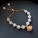原創設計法式氣質白貓眼石配貝殼吊墜手鍊女文藝時尚水晶手鍊