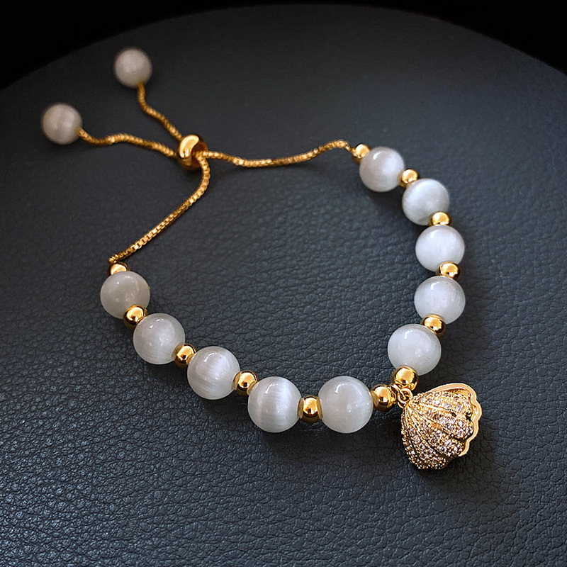 原創設計法式氣質白貓眼石配貝殼吊墜手鍊女文藝時尚水晶手鍊