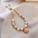 原創設計法式氣質白貓眼石配貝殼吊墜手鍊女文藝時尚水晶手鍊