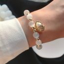 原創設計法式氣質白貓眼石配貝殼吊墜手鍊女文藝時尚水晶手鍊