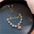 原創設計法式氣質白貓眼石配貝殼吊墜手鍊女文藝時尚水晶手鍊